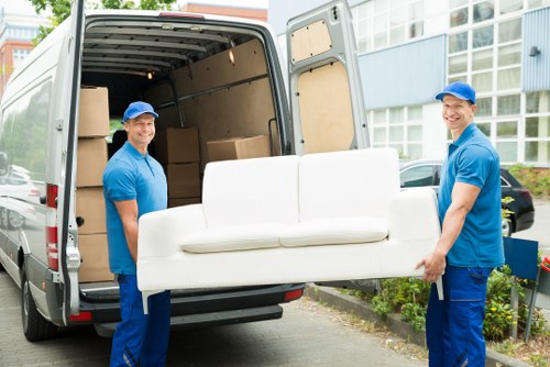 Professional movers handling household items