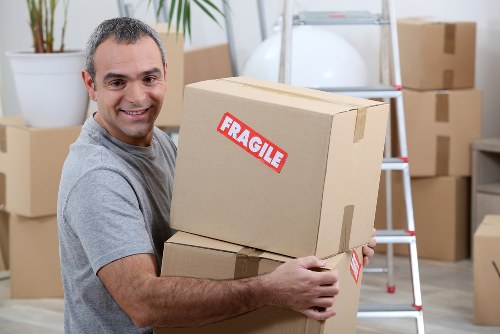 Large removal van loading heavy furniture