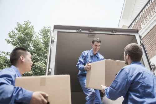 Packing services by Movers Forest Gate with organized boxes