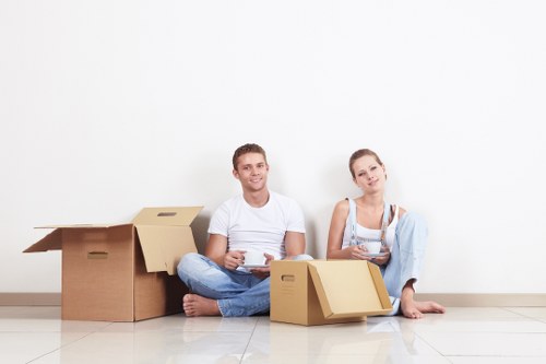 Professional movers handling household items in Penge