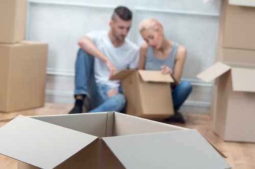 Professional packers organizing boxes and household items for a move