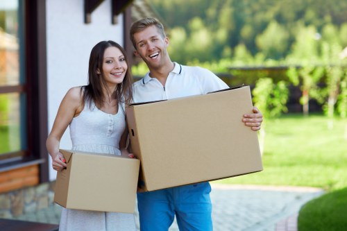 Professional movers securing items in a truck