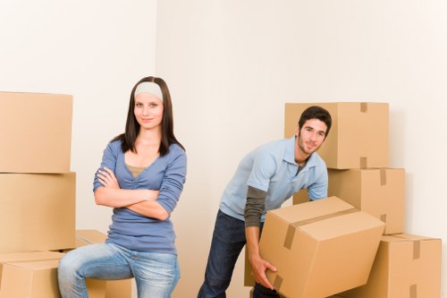 Experienced Enfield Lock movers packing a living room